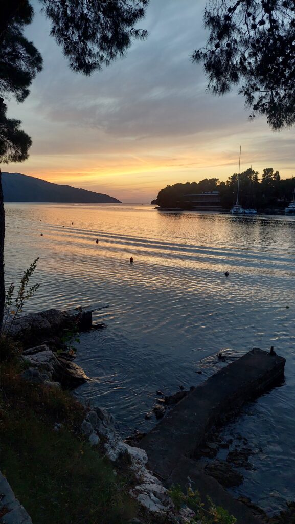 Sunset in Stari Grad with a sea view and yacht.