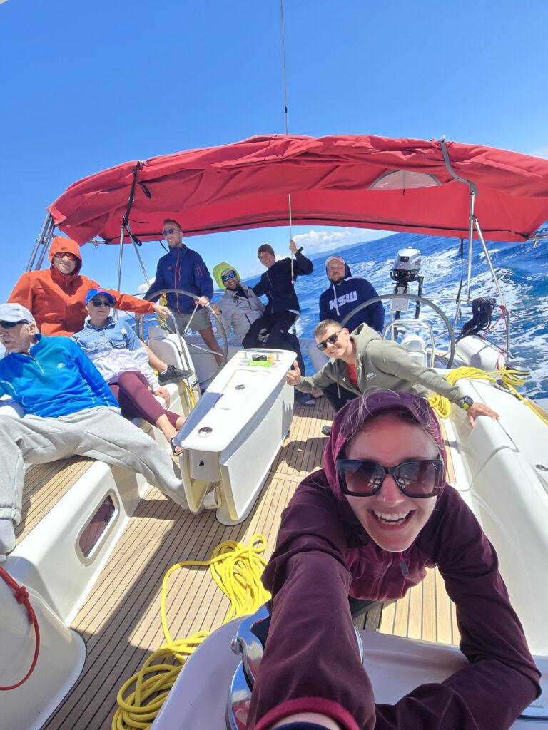 Dynamic photo of a group on a sailing yacht during sailing to Vis. Selife
