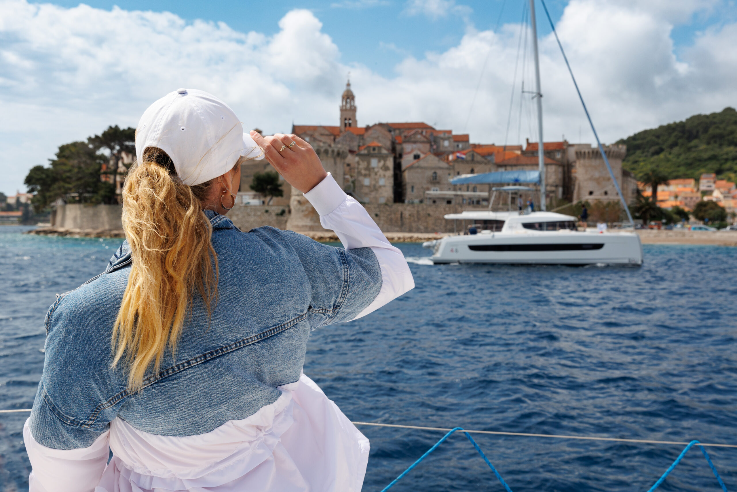 A pretty girl admiring the town of Korcula